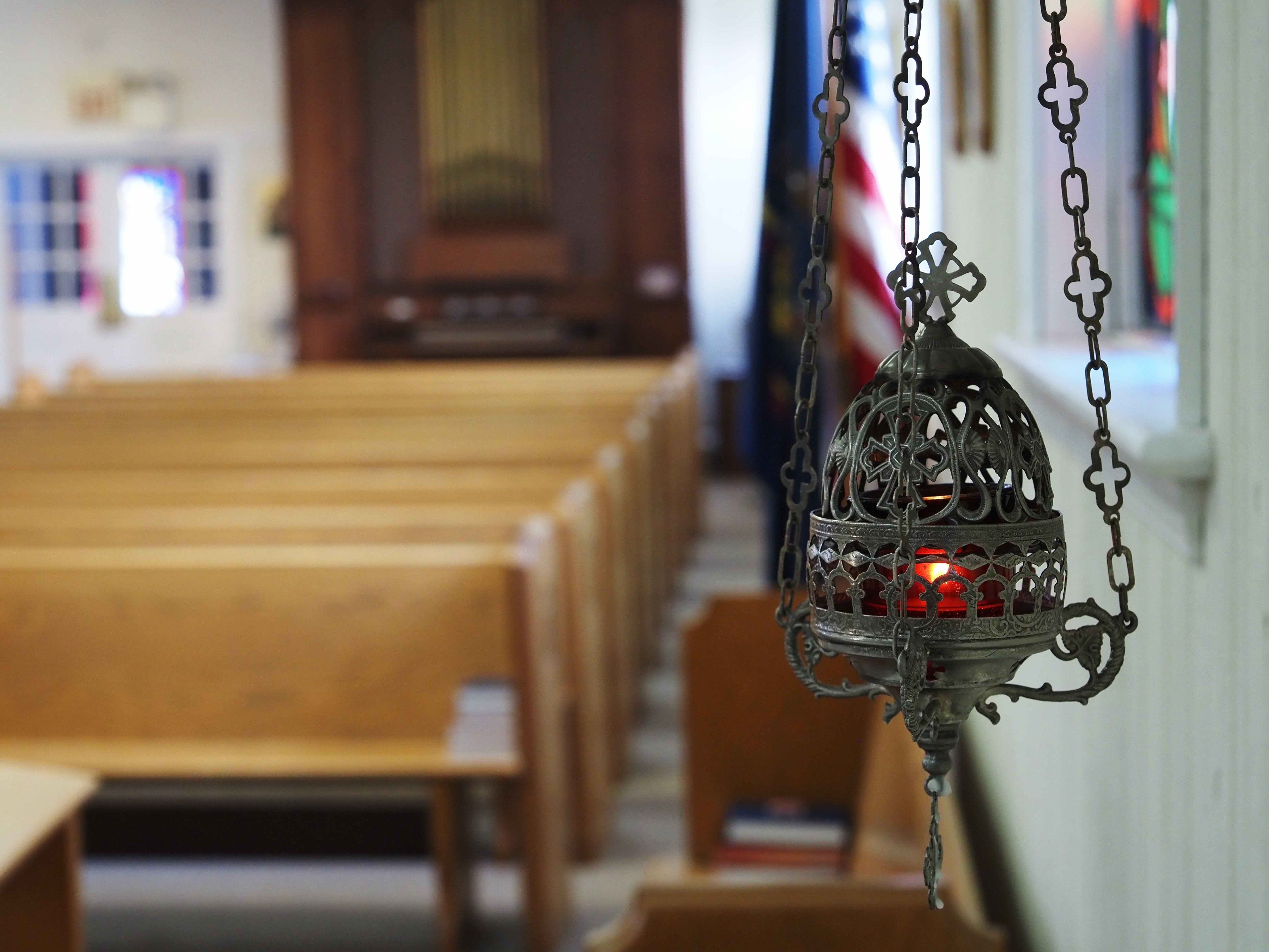Sanctuary lamp hanging beside the pews